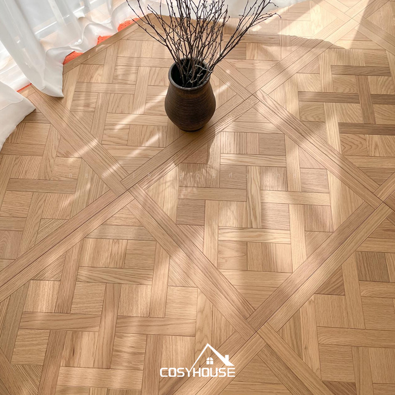 Light herringbone and grid parquet flooring in sunlit room