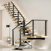 Steel staircase with wood treads and cable railing for modern indoor home project